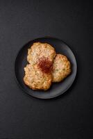 Delicious fried minced chicken cutlets with salt, spices and herbs photo