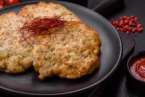 Delicious fried minced chicken cutlets with salt, spices and herbs photo