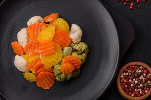 Delicious fresh vegetables broccoli, cauliflower, carrots steamed with salt photo