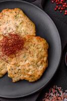 Delicious fried minced chicken cutlets with salt, spices and herbs photo