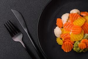 Delicious fresh vegetables broccoli, cauliflower, carrots steamed with salt photo