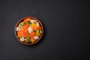 Delicious fresh vegetables broccoli, cauliflower, carrots steamed with salt photo