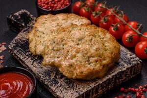 Delicious fried minced chicken cutlets with salt, spices and herbs photo