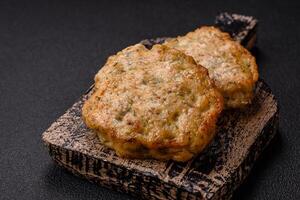 Delicious fried minced chicken cutlets with salt, spices and herbs photo