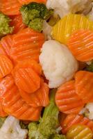 Delicious fresh vegetables broccoli, cauliflower, carrots steamed with salt photo