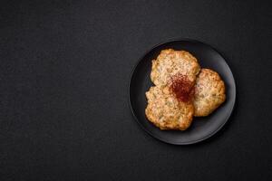 Delicious fried minced chicken cutlets with salt, spices and herbs photo