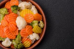 Delicious fresh vegetables broccoli, cauliflower, carrots steamed with salt photo