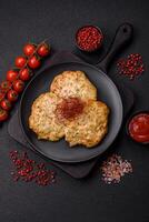 Delicious fried minced chicken cutlets with salt, spices and herbs photo