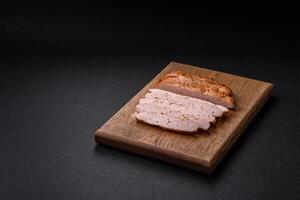 Delicious juicy turkey or chicken steak with salt, spices and herbs photo