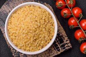 Raw stelline pasta from durum wheat with salt and spices photo