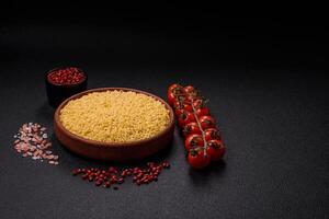 Raw anellini pasta from durum wheat with salt and spices photo
