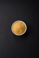 Raw stelline pasta from durum wheat with salt and spices photo