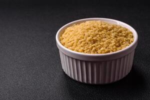 Raw stelline pasta from durum wheat with salt and spices photo