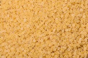 Raw stelline pasta from durum wheat with salt and spices photo