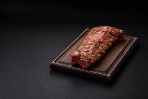 Raw pork ribs marinated with salt, spices and herbs photo