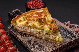 Delicious quiche with broccoli, cheese, chicken, spices and herbs photo