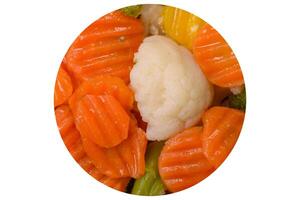 Delicious fresh vegetables broccoli, cauliflower, carrots steamed with salt photo