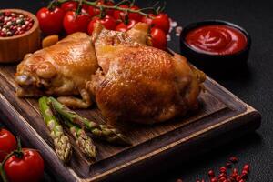 Delicious juicy chicken thighs baked on the grill with salt photo