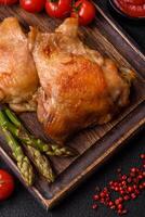 Delicious juicy chicken thighs baked on the grill with salt photo
