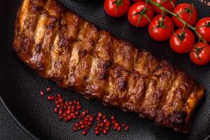 Delicious juicy grilled ribs with honey and mustard sauce photo