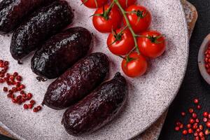 Delicious black blood sausage or black pudding with spices and herbs photo