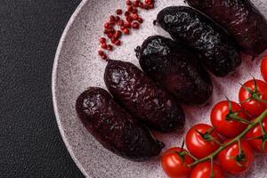 Delicious black blood sausage or black pudding with spices and herbs photo