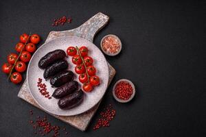 Delicious black blood sausage or black pudding with spices and herbs photo