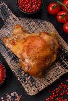 Delicious juicy chicken thighs baked on the grill with salt photo