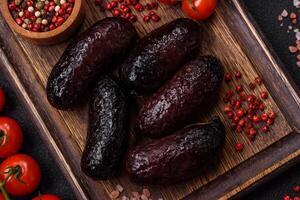 Delicious black blood sausage or black pudding with spices and herbs photo