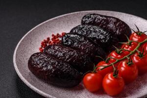 Delicious black blood sausage or black pudding with spices and herbs photo