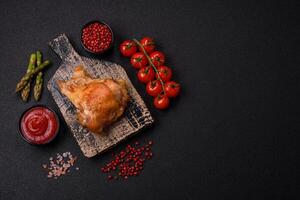 Delicious juicy chicken thighs baked on the grill with salt photo