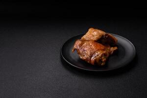 Delicious juicy chicken thighs baked on the grill with salt photo