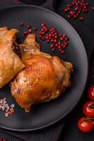 Delicious juicy chicken thighs baked on the grill with salt photo