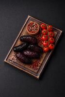 Delicious black blood sausage or black pudding with spices and herbs photo