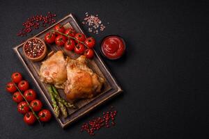 Delicious juicy chicken thighs baked on the grill with salt photo