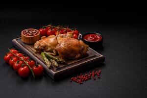 Delicious juicy chicken thighs baked on the grill with salt photo