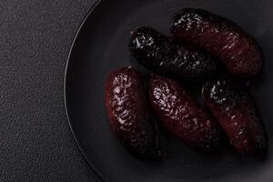 Delicious black blood sausage or black pudding with spices and herbs photo