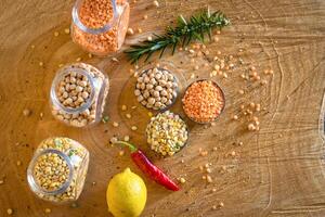 Raw cereals set on wooden background photo