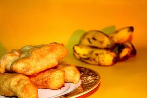 Pisang goreng, a traditional Indonesian snack made from simple ingredients. Banana, flour, and water photo