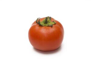 Tomatoes and cucumbers on a white background photo