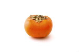 Ripe persimmon on the white background photo