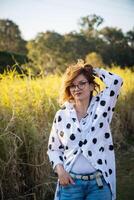 Fashion shot of a beautiful boho style girl on nature background. Boho, hippie. photo