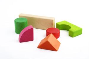 Wooden toy blocks on white background photo