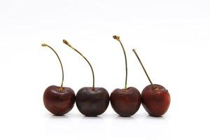 Ripe cherry red on a white background photo