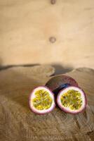 Juicy of Passion Fruit on wooden background photo