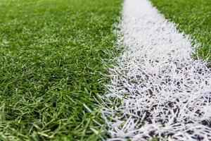 white line on soccer field grass photo