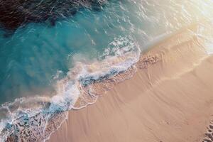 Beach with turquoise waters and golden sands, kissed by the warm sun of summer photo