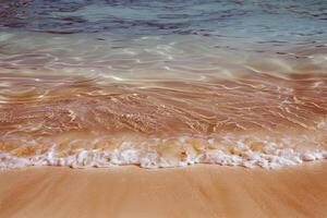 Beach with turquoise waters and golden sands, kissed by the warm sun of summer photo