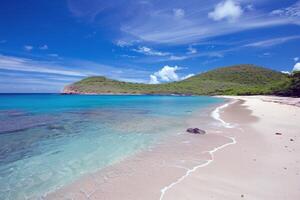 Beach with turquoise waters and golden sands, kissed by the warm sun of summer photo