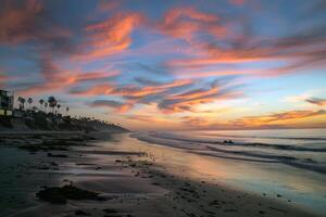 Sunset painting the sky with hues of orange, pink, and purple, signaling the end of summer day photo